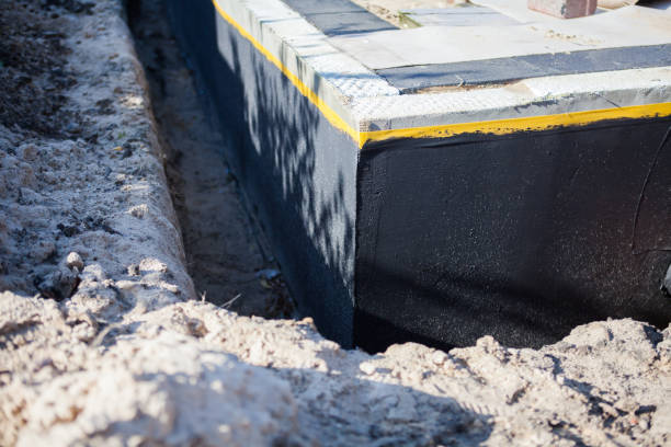 Professional Waterproofing technician working in Waterford, VA